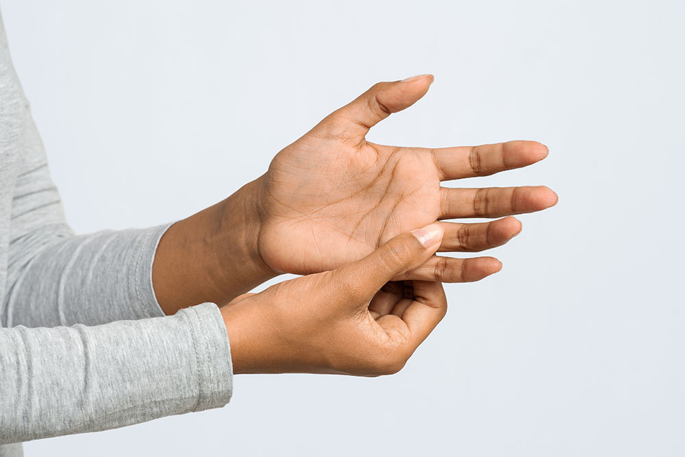 Close up of woman hand with finger pain